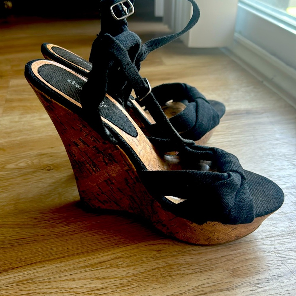 Charlotte Russe woman’s shoe size 8. Black knit/tan wedge sandal